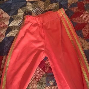 Pink sweats with gold strips on the side